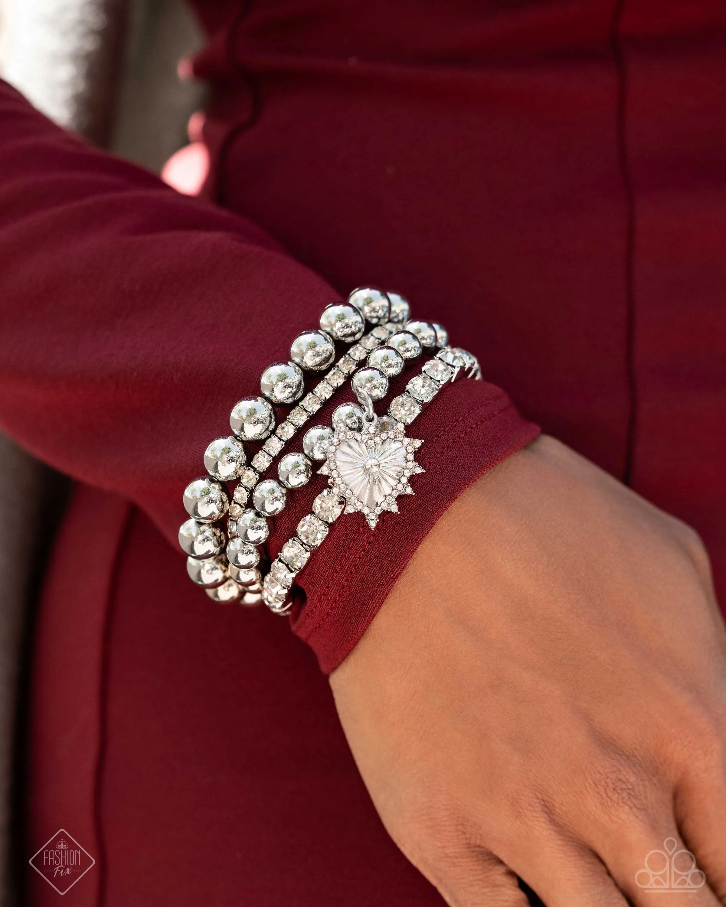 Excessive Elegance - White - Rhinestone Silver Bead and Heart Charm Paparazzi Stretchy Bracelet - September 2024 Fiercely 5th Avenue