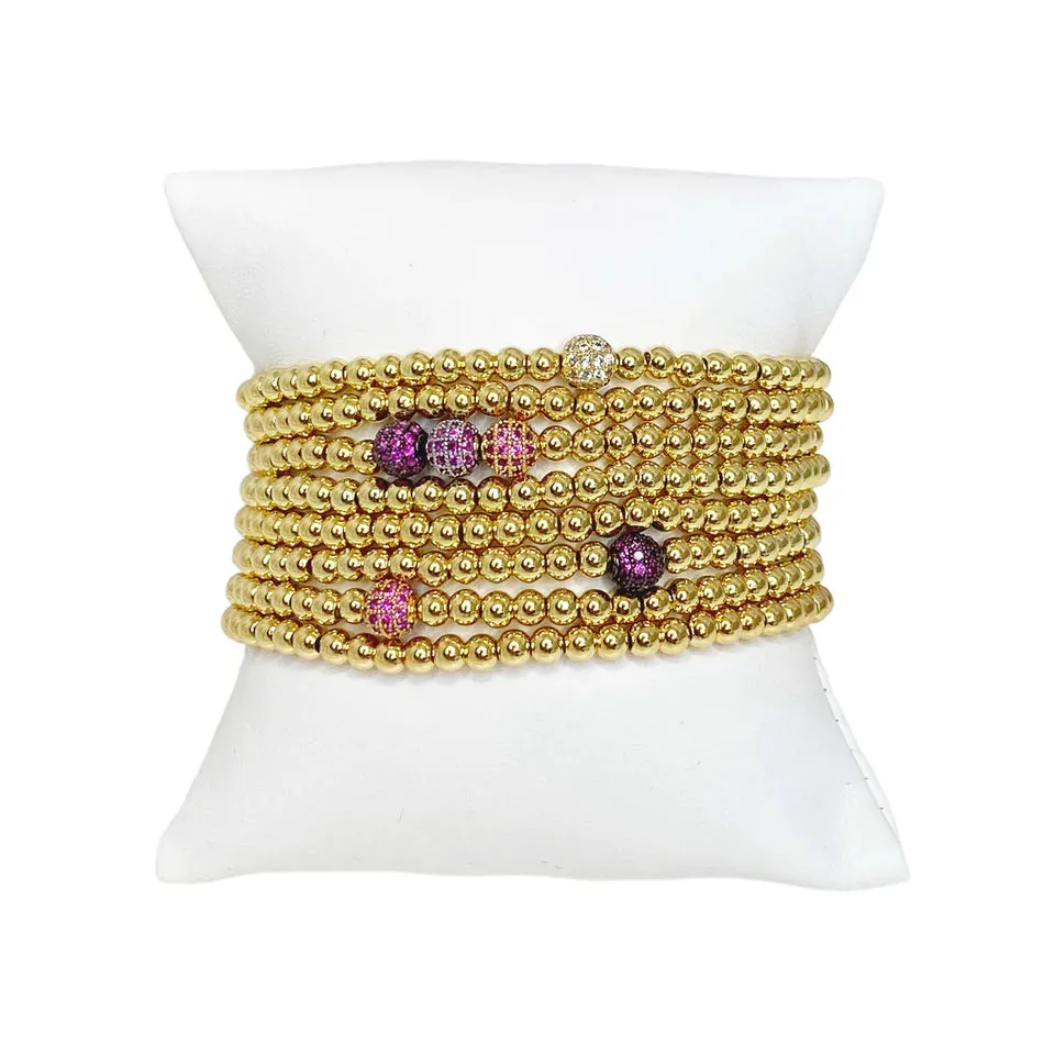 Golden Stack Of Beaded Bracelets