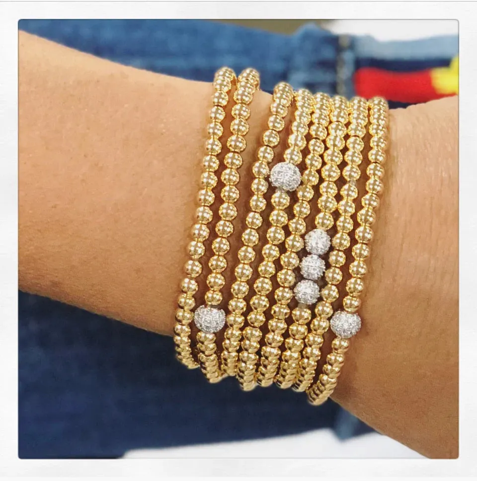 Golden Stack Of Beaded Bracelets