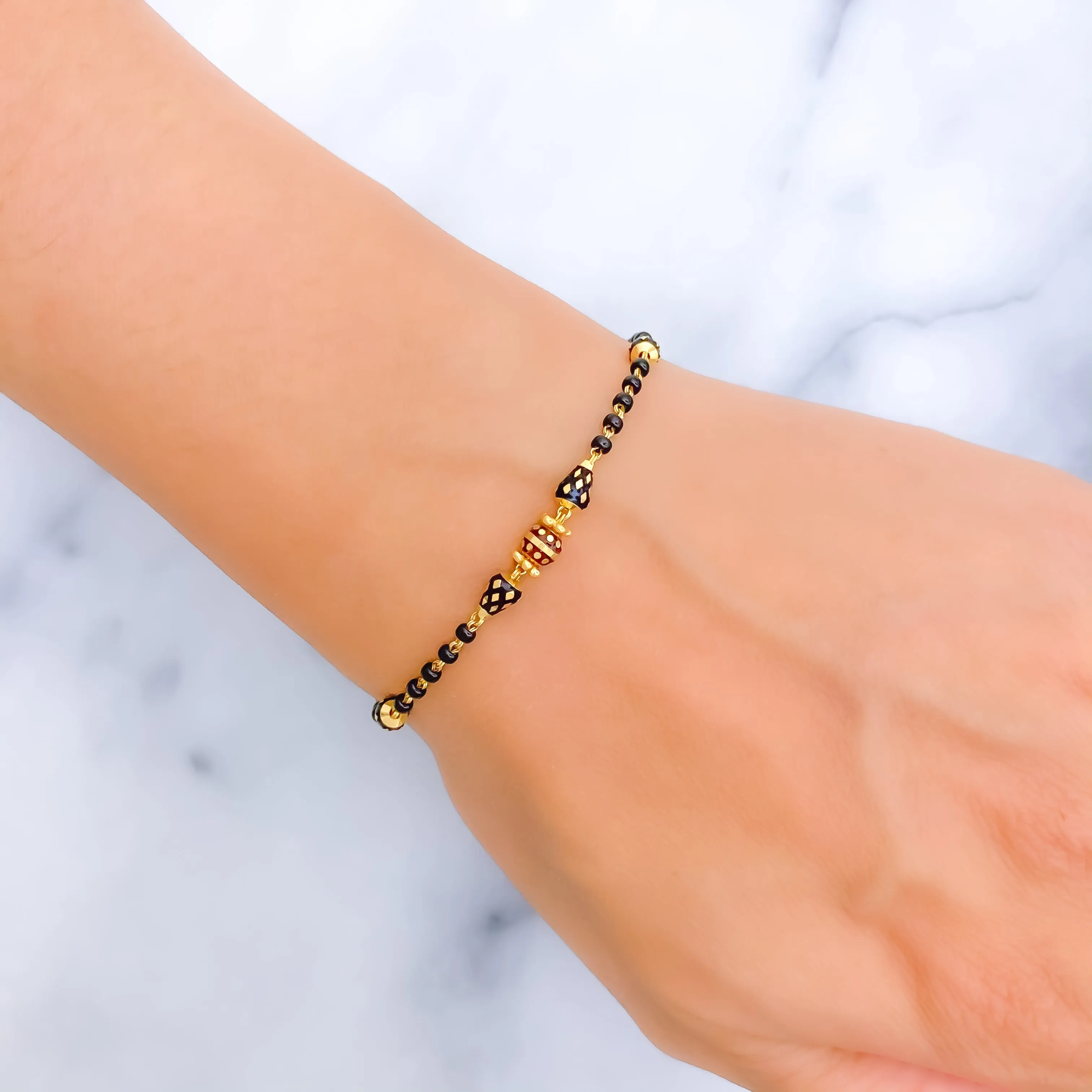 Luminous Lightweight 22k Gold Black Bead Bracelet