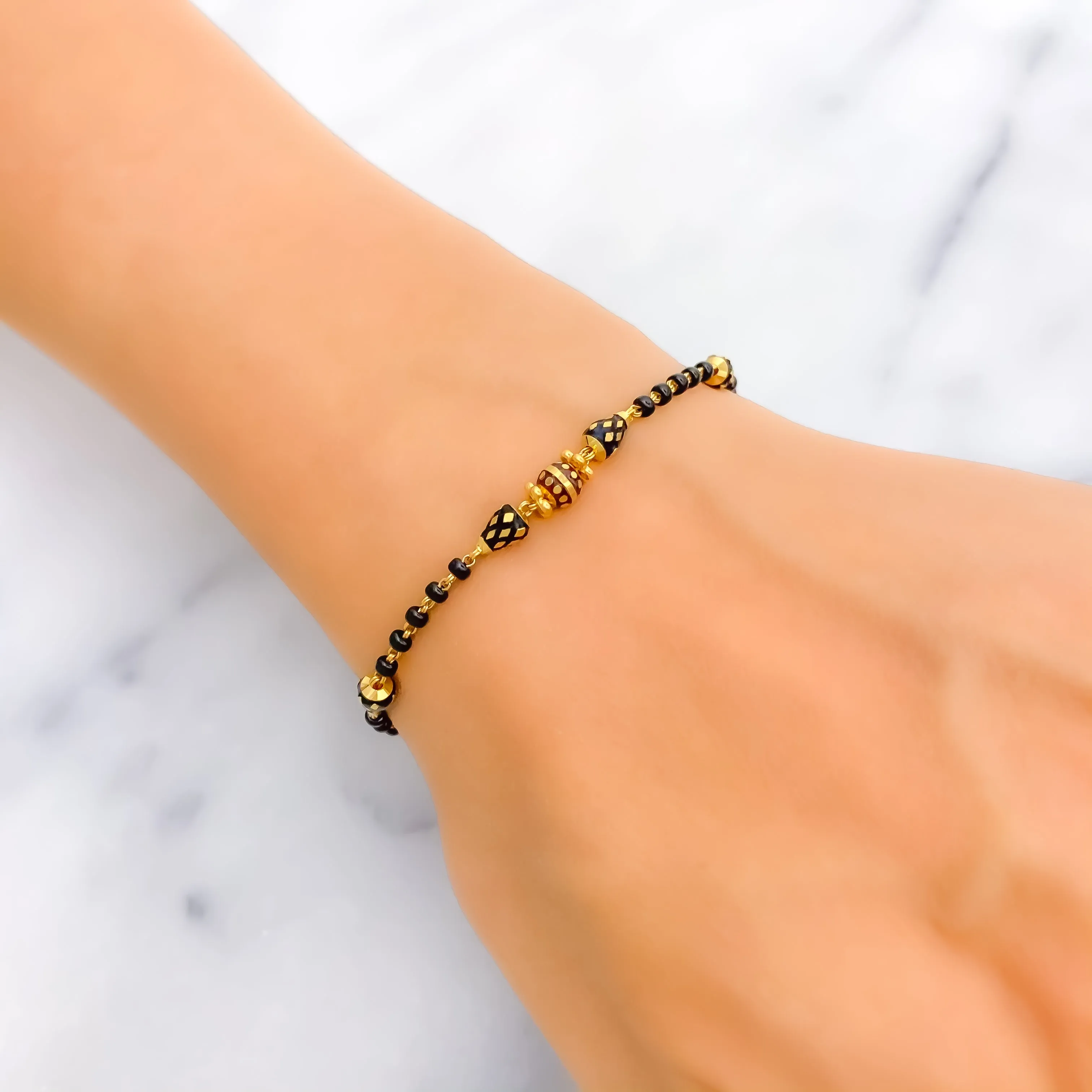 Luminous Lightweight 22k Gold Black Bead Bracelet
