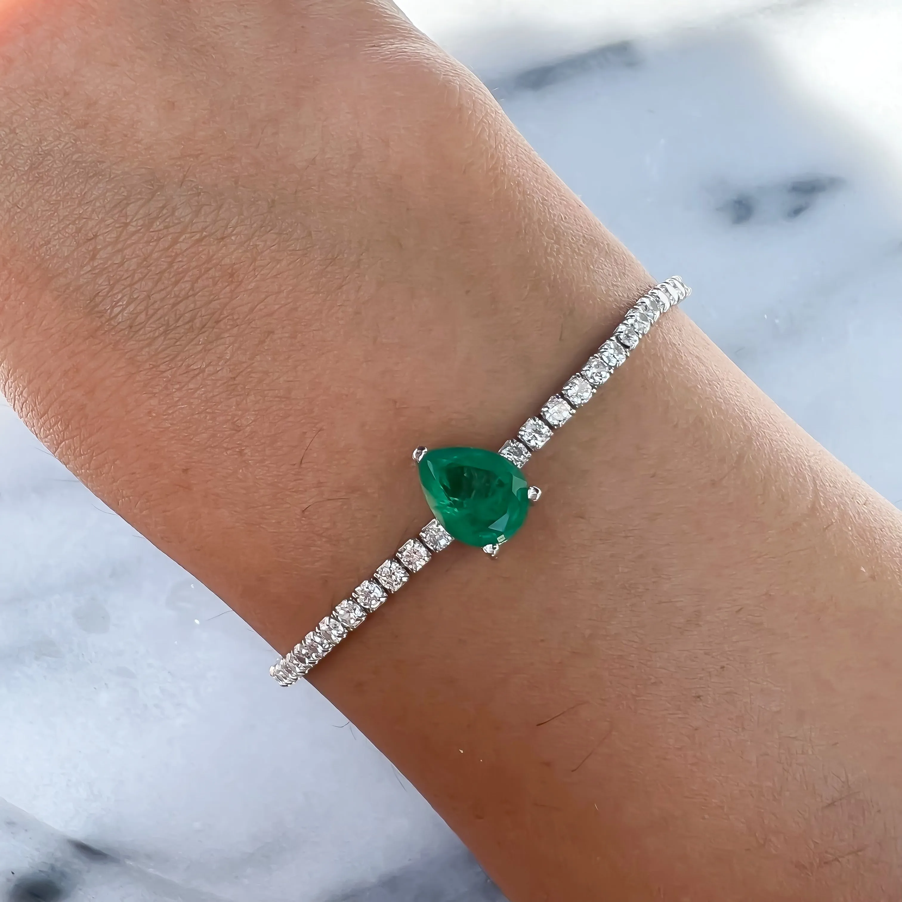 Sterling silver single pear emerald stone bracelet